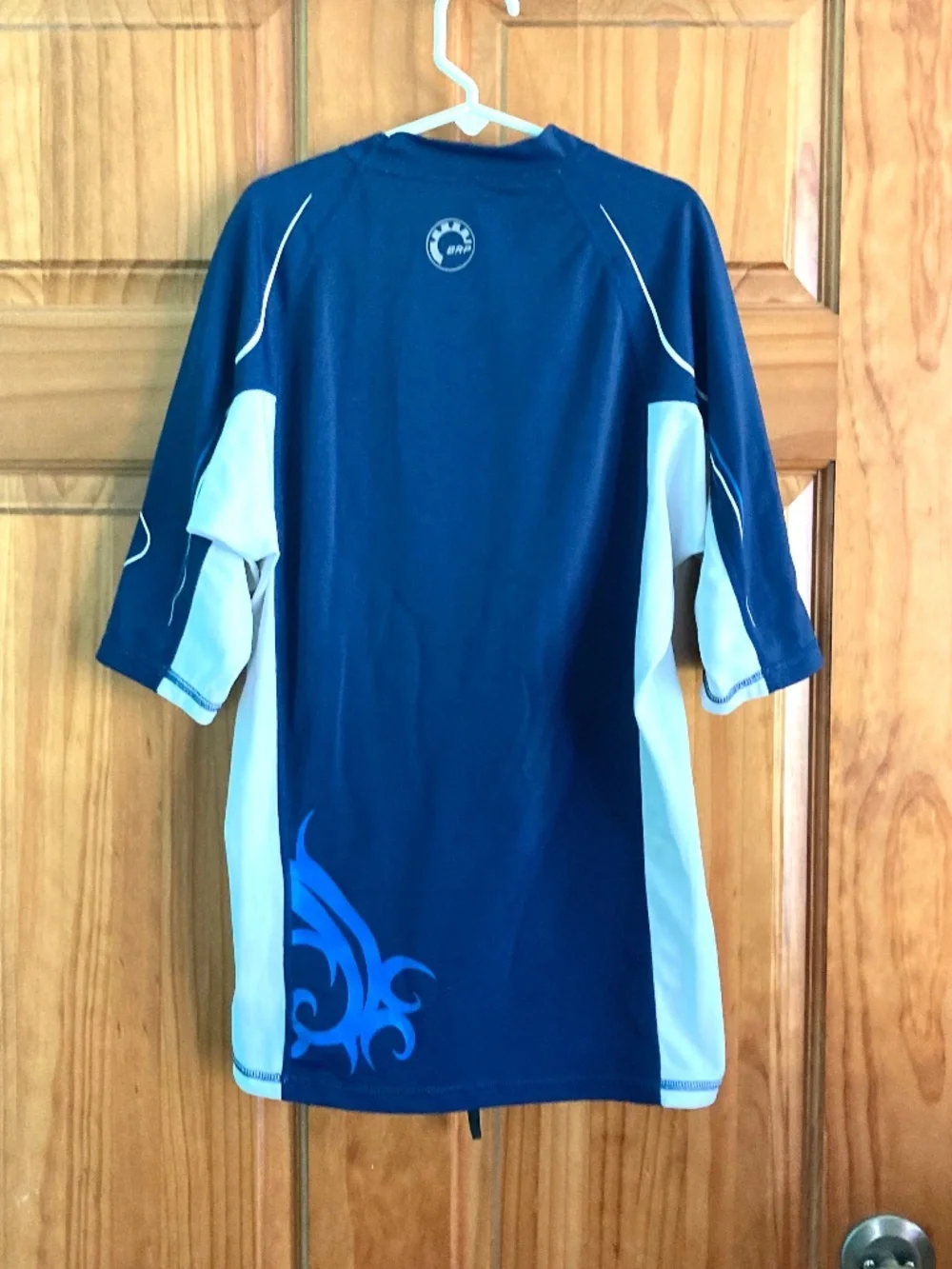 Boy’s size 12/14 Sea-Doo navy blue and white short sleeved swim shirt/rash guard